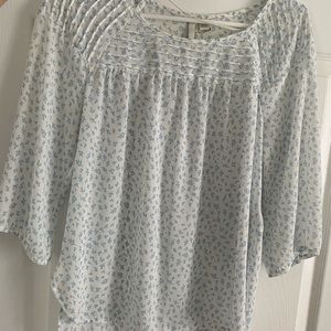 White and blue floral blouse